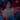 Person playing a video game with headphones on in a dark room with colorful lights.