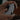 A man's hand holding a game console controller