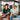 Two people playing video games together on a couch.